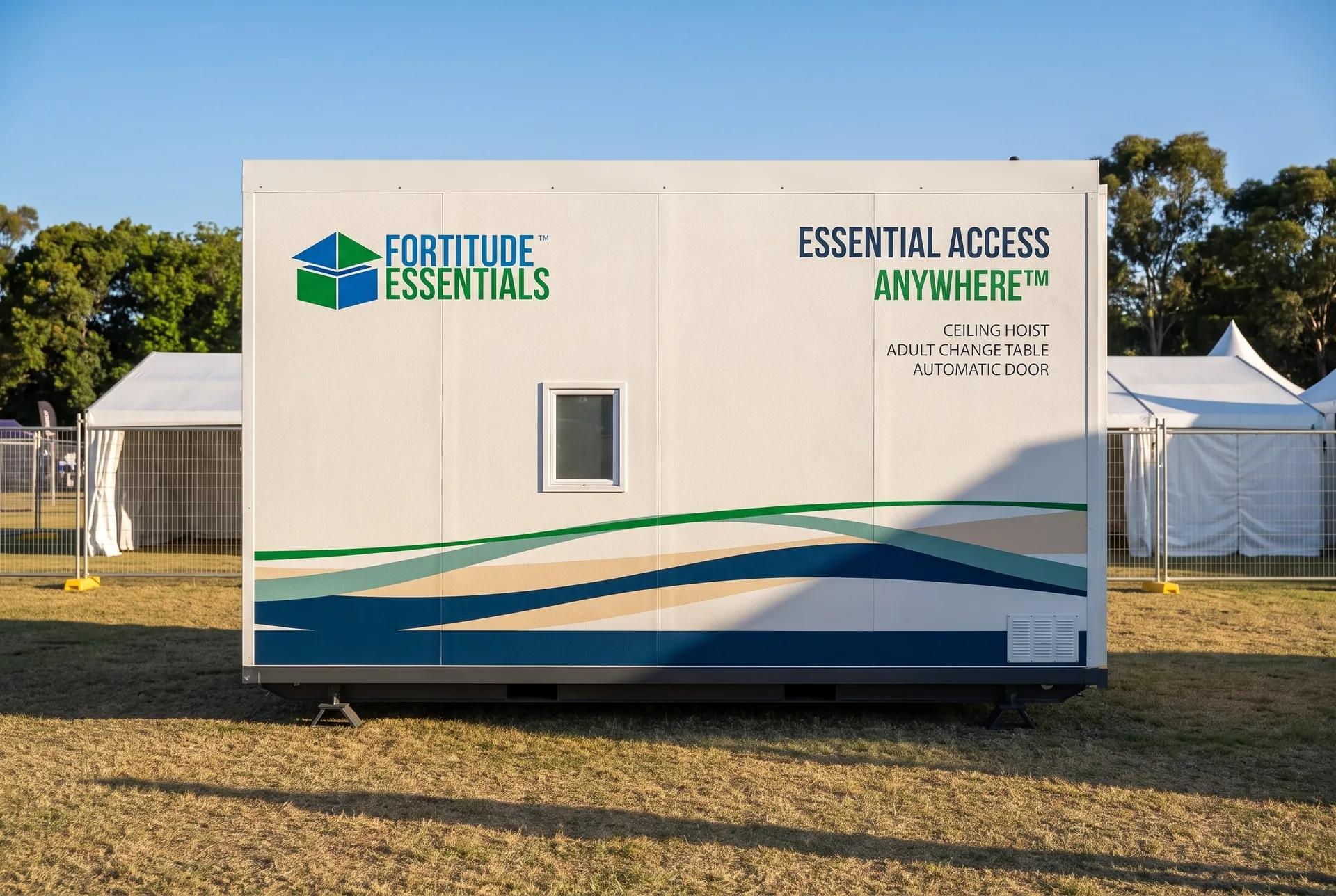 Concept render of the Fortitude Essentials Essential Access Pod, accessible adult change facility, side view at a community event.