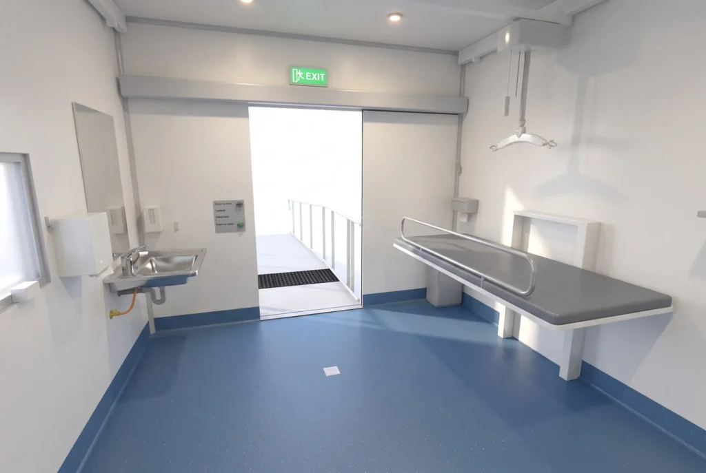 Concept render of the Fortitude Essentials Essential Access Pod, adult change room, interior change table and door.
