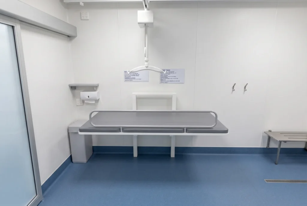 Concept render of the Fortitude Essentials Essential Access Pod, adult change room with shower, change table and ceiling hoist.