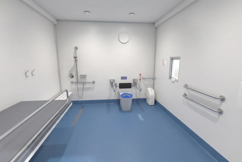 Concept render of the Fortitude Essentials Essential Access Pod, adult change room with shower, interior toilet and shower area.