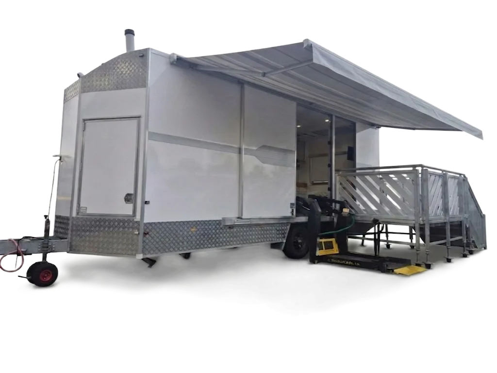 Wheelchair accessible accommodation: the Mobile Access Facility with awning deployed, side view